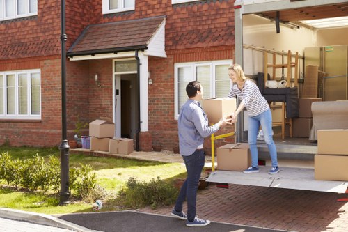 Removals van handling a residential move in Swiss Cottage