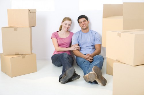 Packed moving boxes ready for transport in Swiss Cottage