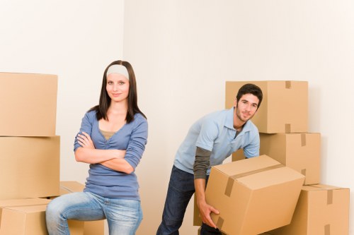 Careful wrapping of fragile household items before transport