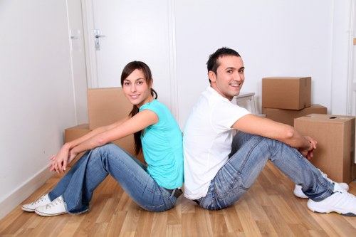 Packed boxes and furniture ready for loading in a Swiss Cottage home
