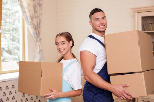 Packing and loading furniture into a moving van in Swiss Cottage